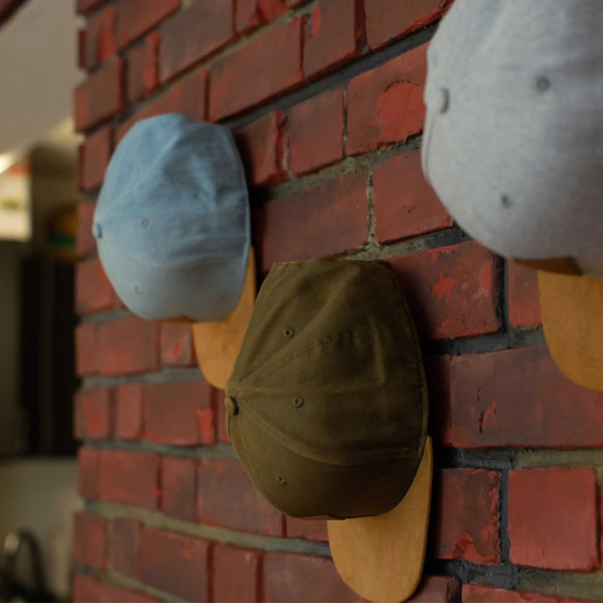 Cap Haken an der Wand